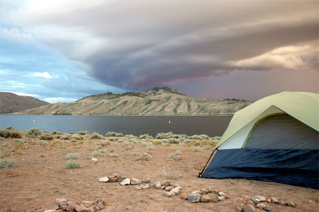 A tent on the shore of the river in Moab, Utah