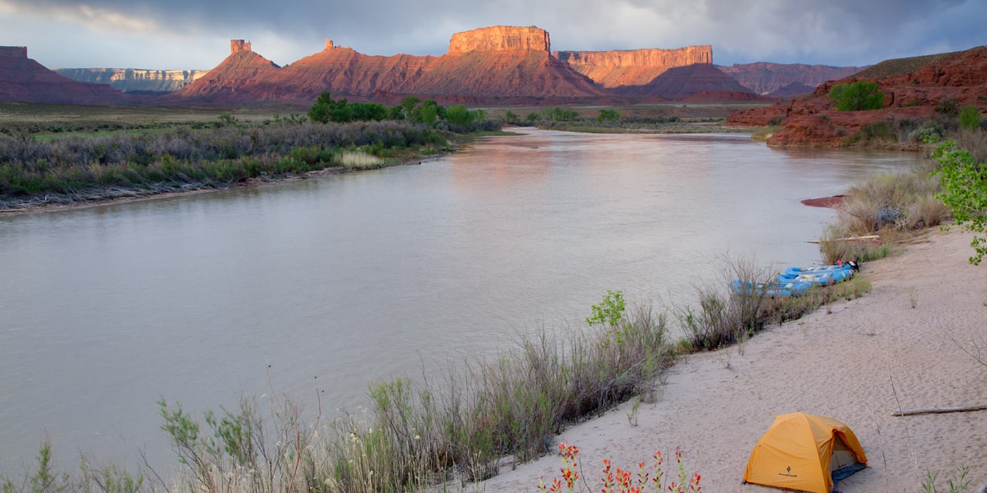 The sun sets over the fisher towers rafting section in moab