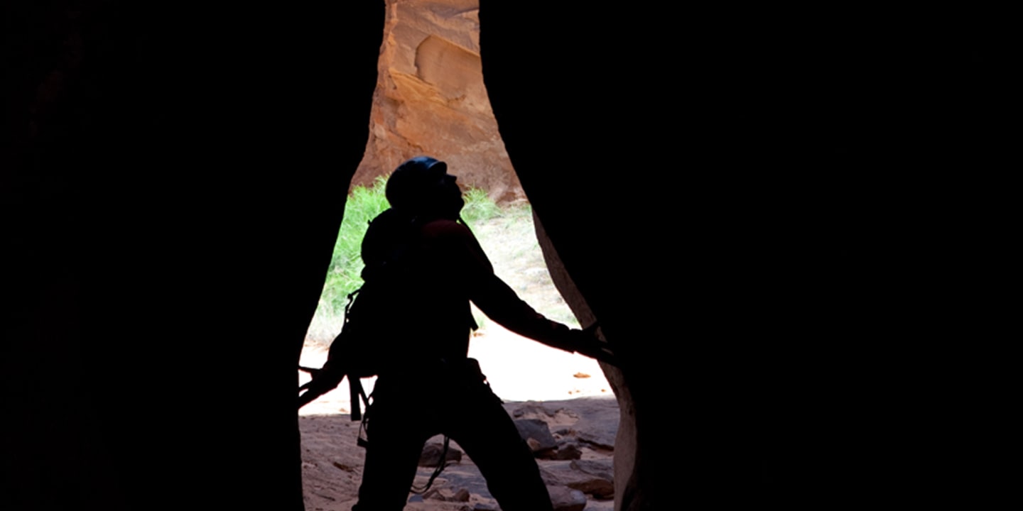 A person looks around the medieval chamber in moab