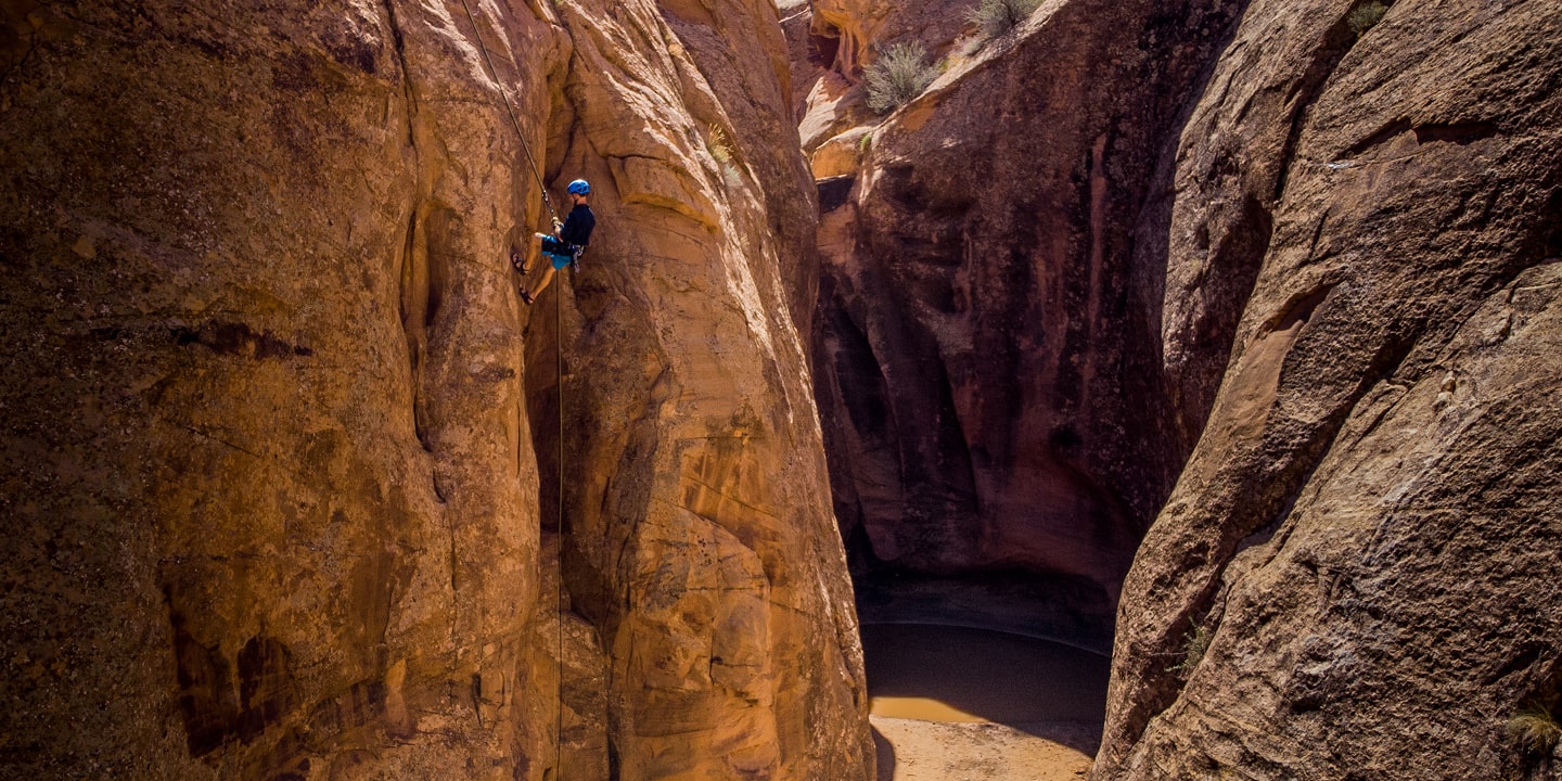 A person canyoneering in entrajo canyon in moab