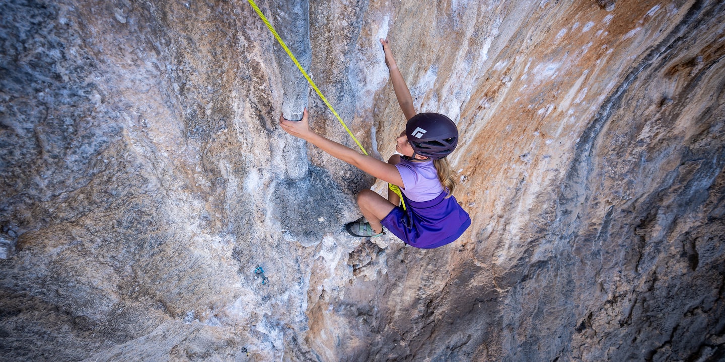 women top roping a rock climbing route