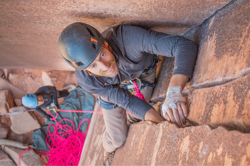 A man crack climbs during the indian creek crack climbing camp