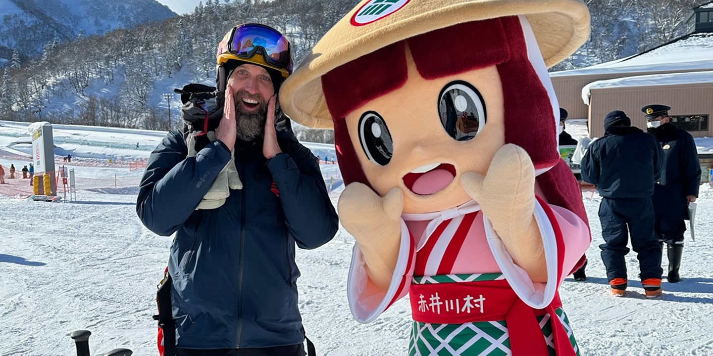 A man mimics a large mascot doll in japan