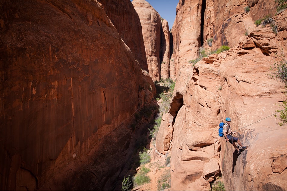 A person canyoneering the rock of ages route in moab