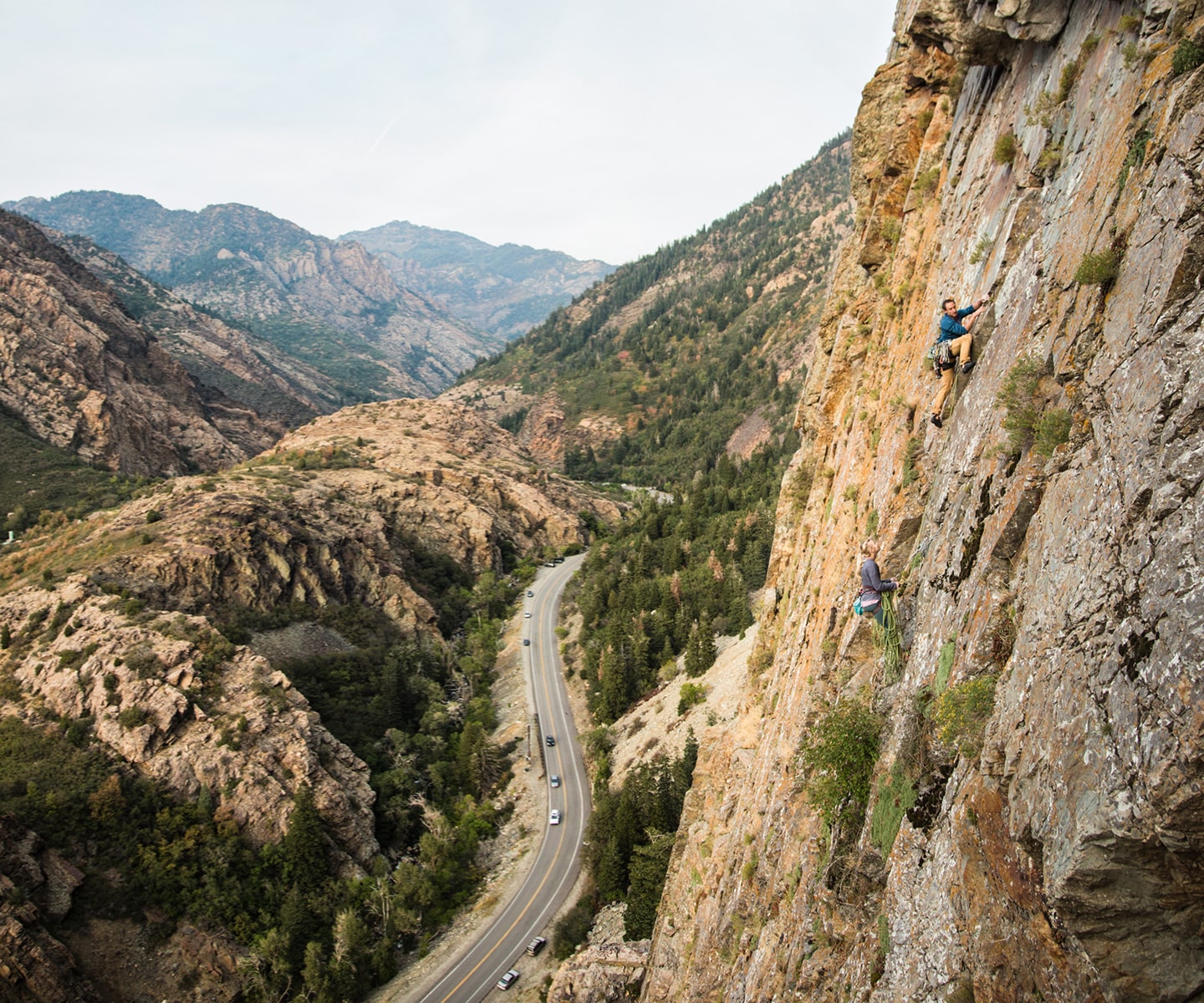 rocking climbers on rock wall