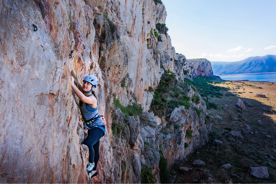 woman rock climbing on Sicily rock climbing trip