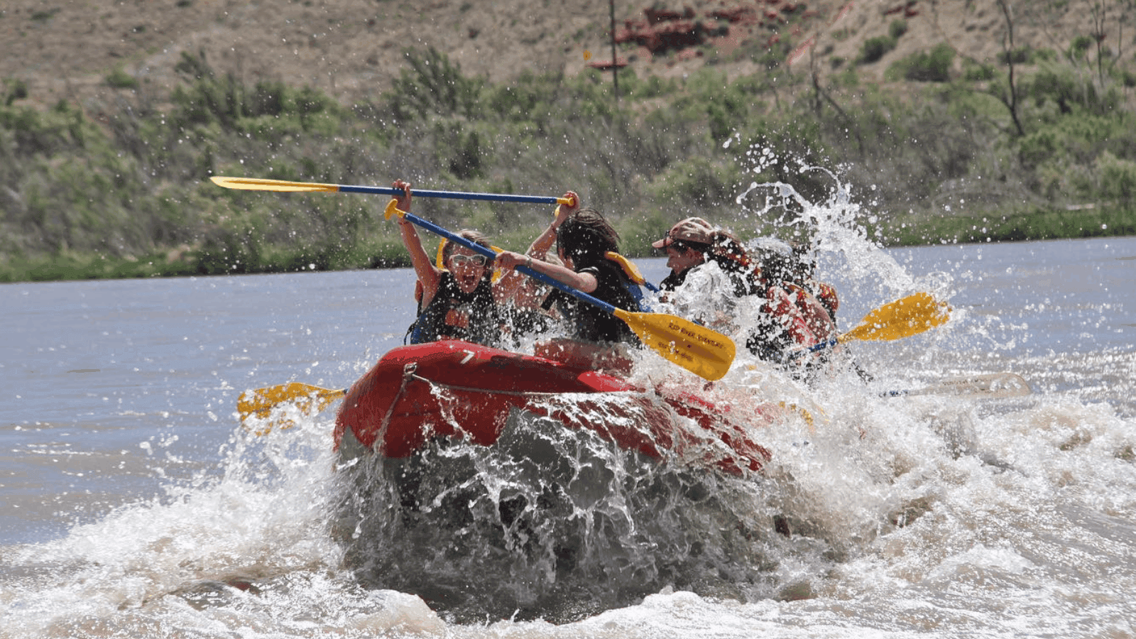 people on a boat during rafting season in moab