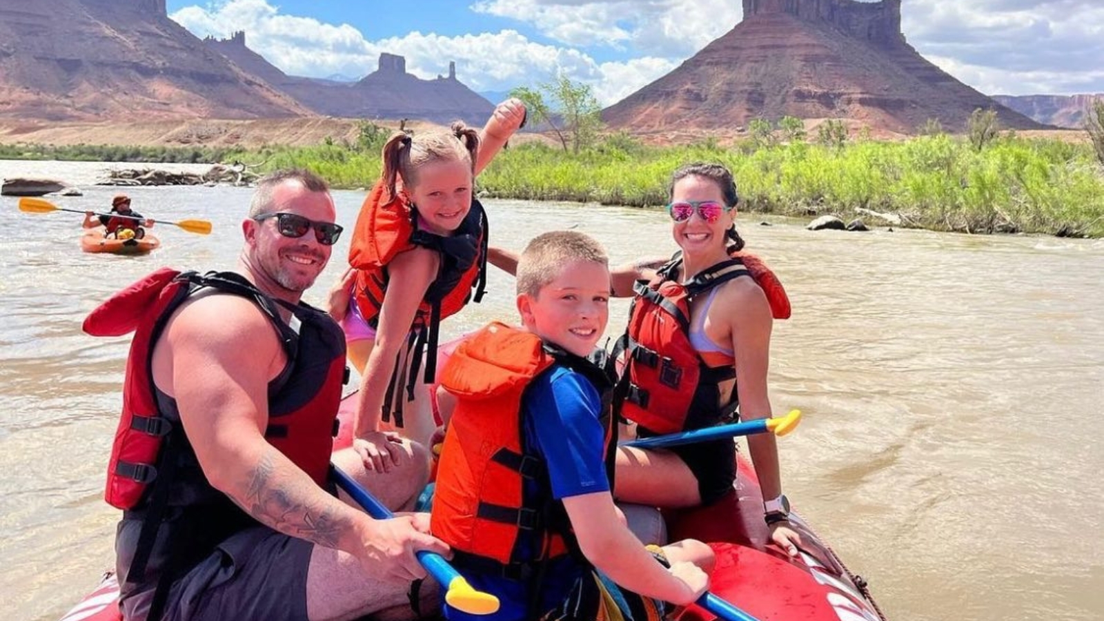 a family of four raft in moab utah