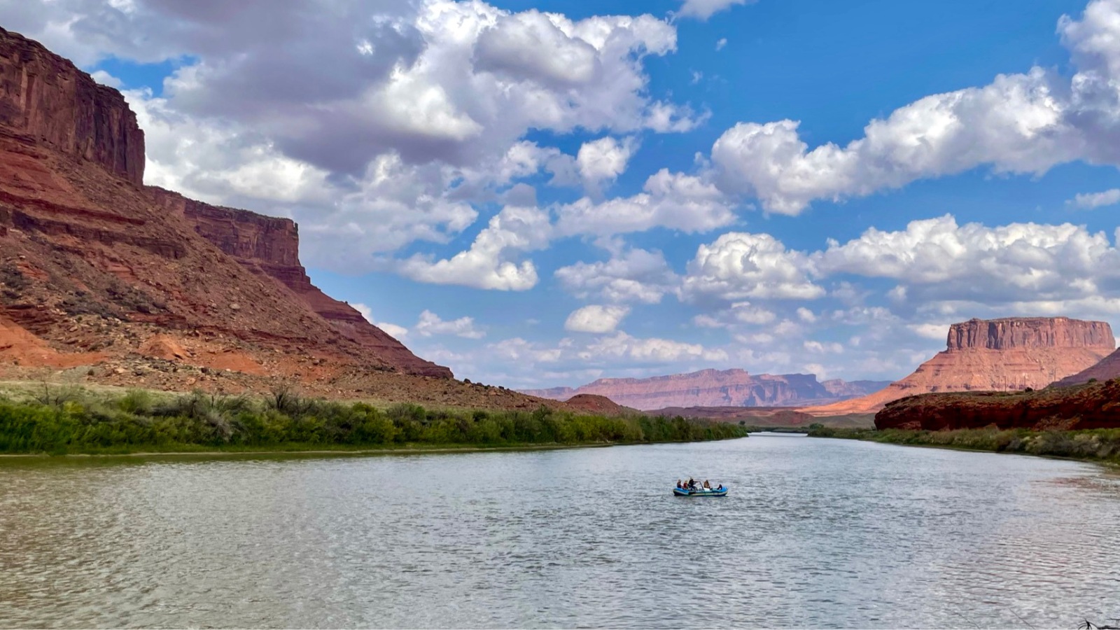 A raft floats down the river near arches national park