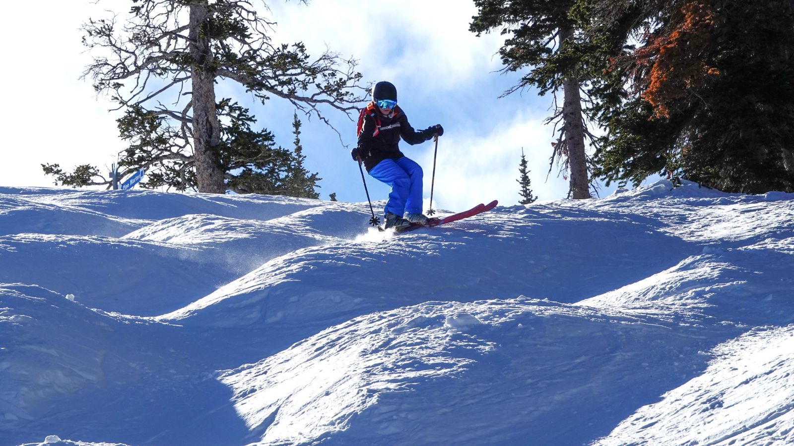 A women skis down moguls at Brighton Ski resort in Utah